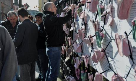 Click on image to see full-sized version Protesters tying shoes to railings at the Pro Cathedral