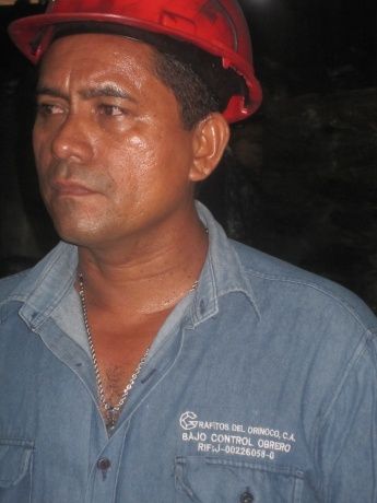 Click on image to see full-sized version A Grafitos worker, April 2011. His overall reads, “Grafitos del Orinoco: Under Worker Control”. (Ewan Robertson)