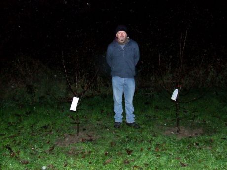 Click on image to see full-sized version Paul between two apple trees planted in memory of dear friends