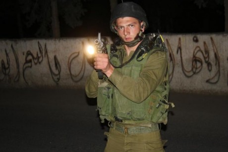 Click on image to see full-sized version IDF Soldier points his gun at Bil'in based journalist