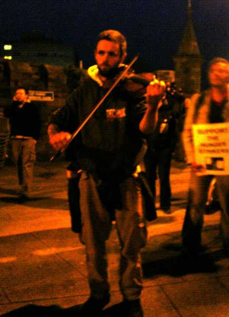Fiddler Playing A Lament