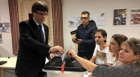 Click on image to see full-sized version The president of Catalonia, Carles Puigdemont casts his vote - turn out is exceptionally high despite Spanish state violence.